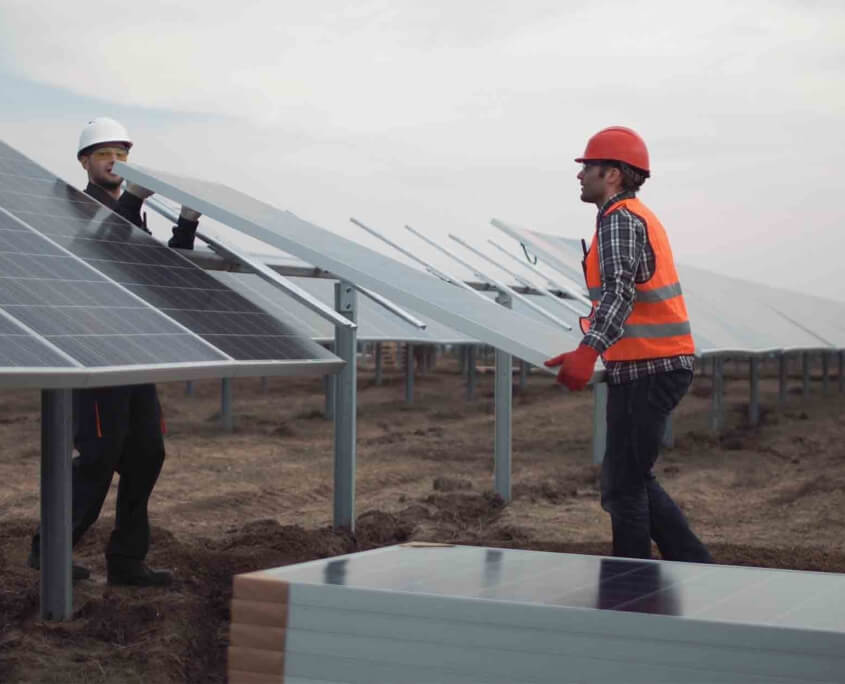 O3_Interior_two men carrying solar panel