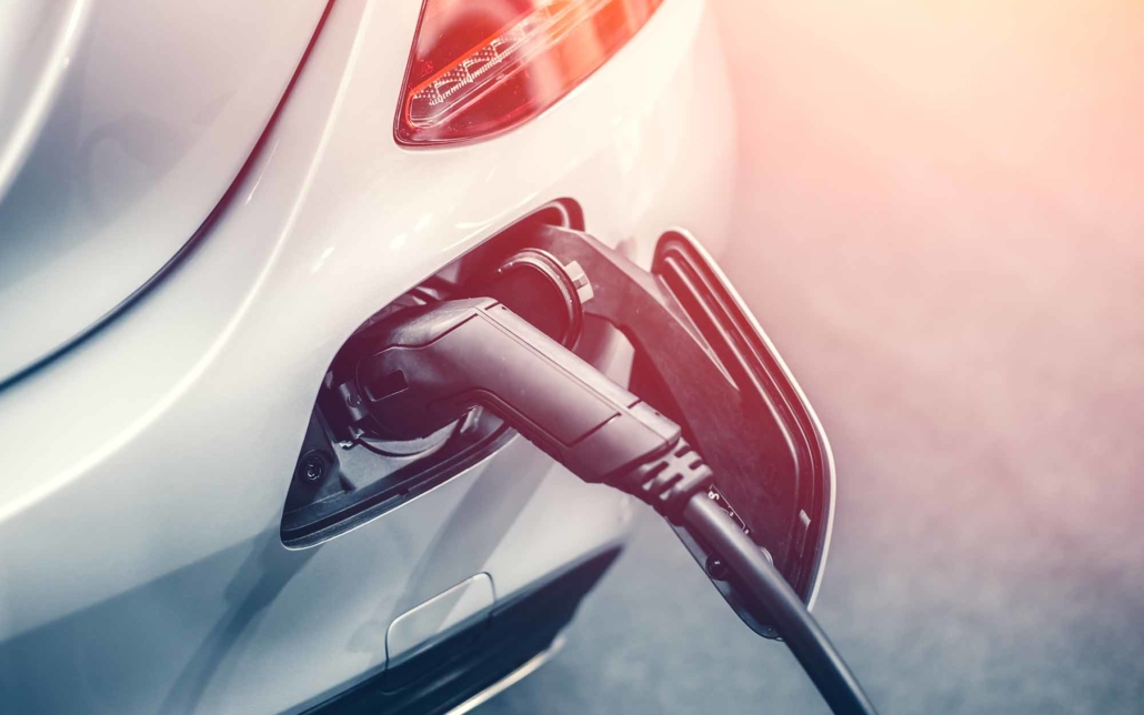 EV car charger connected to a car EV car charger connected to a car
